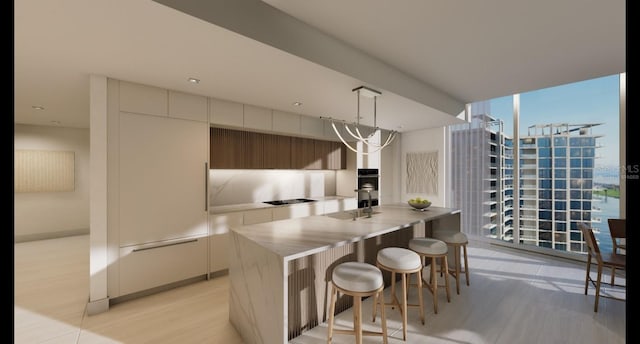 kitchen featuring a kitchen island, decorative light fixtures, black cooktop, a notable chandelier, and floor to ceiling windows