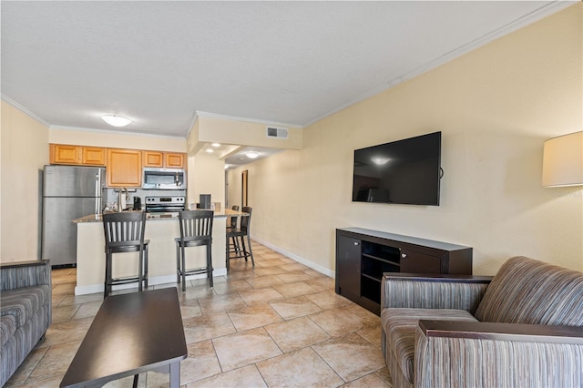 2506 N Rocky Point Dr Unit 272, Tampa, FL 33607 - living room with ornamental molding and baseboards