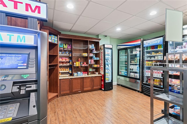 2506 N Rocky Point Dr Unit 272, Tampa, FL 33607 - office area with light wood finished floors, beverage cooler, and a paneled ceiling
