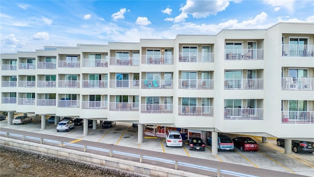 2506 N Rocky Point Dr Unit 272, Tampa, FL 33607 - view of apartment building / complex with covered parking