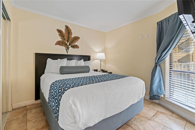 2506 N Rocky Point Dr Unit 272, Tampa, FL 33607 - tiled bedroom with ornamental molding and baseboards