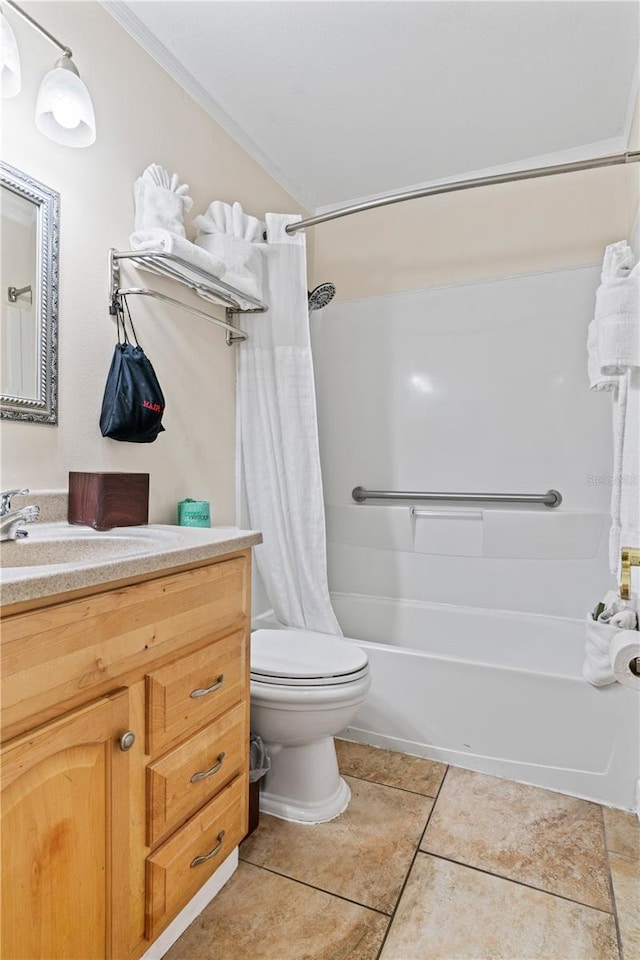2506 N Rocky Point Dr Unit 272, Tampa, FL 33607 - bathroom featuring vanity, shower / bath combination with curtain, toilet, tile patterned floors, and crown molding