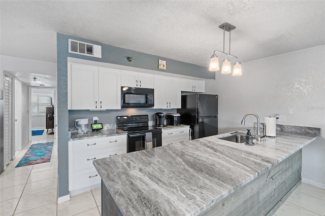 kitchen with kitchen peninsula, black appliances, pendant lighting, white cabinets, and sink