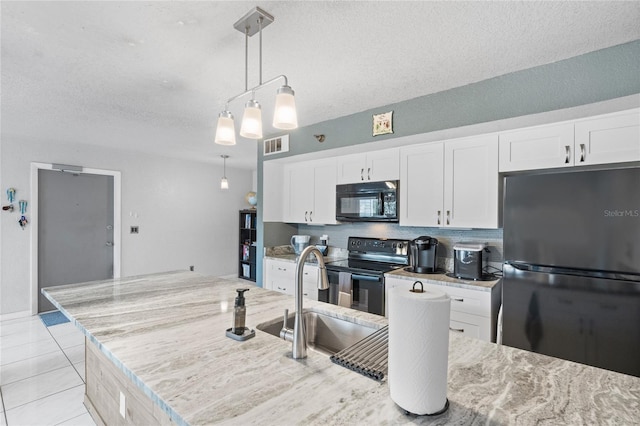 kitchen featuring white cabinetry, sink, and black appliances