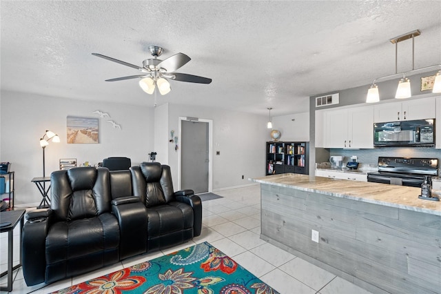 interior space featuring a textured ceiling and ceiling fan