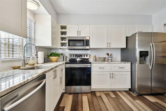 kitchen with stainless steel appliances and white cabinets