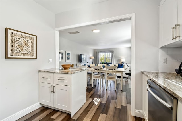 kitchen featuring white cabinetry, light stone countertops, dark hardwood / wood-style floors, and dishwasher