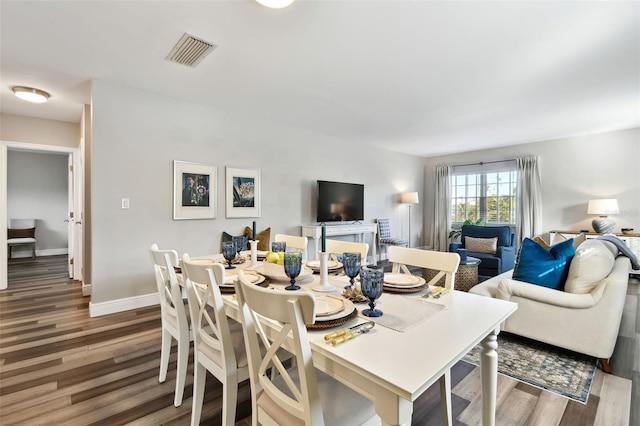 dining space featuring hardwood / wood-style floors