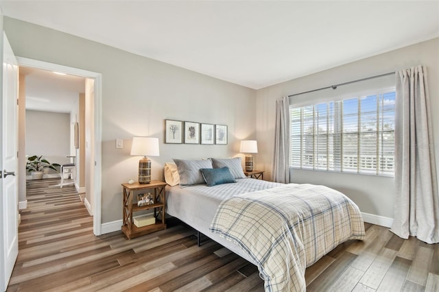 bedroom with wood-type flooring