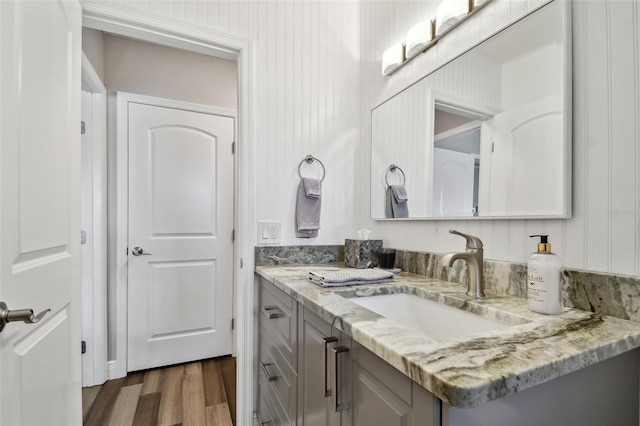 bathroom with vanity and wood-type flooring