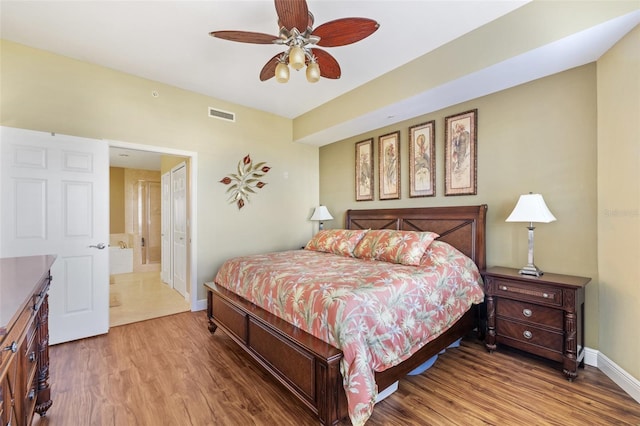 bedroom with hardwood / wood-style flooring and ceiling fan