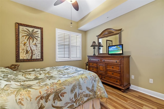 bedroom featuring ceiling fan and light hardwood / wood-style flooring