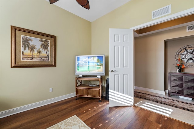 interior space featuring vaulted ceiling, ceiling fan, and dark hardwood / wood-style flooring