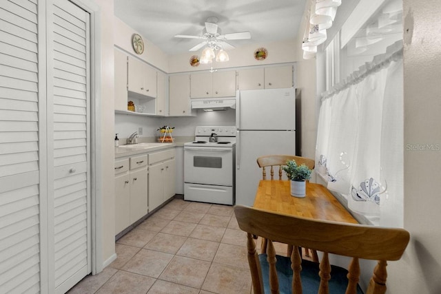 kitchen featuring sink, white appliances, light tile patterned floors, ceiling fan, and white cabinets