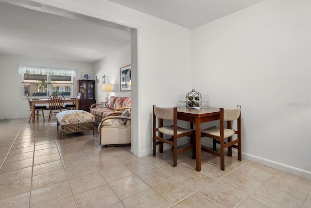 dining area featuring light tile patterned flooring