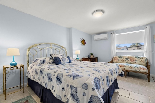 bedroom featuring light tile patterned flooring and a wall unit AC