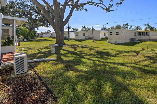 view of yard with central air condition unit