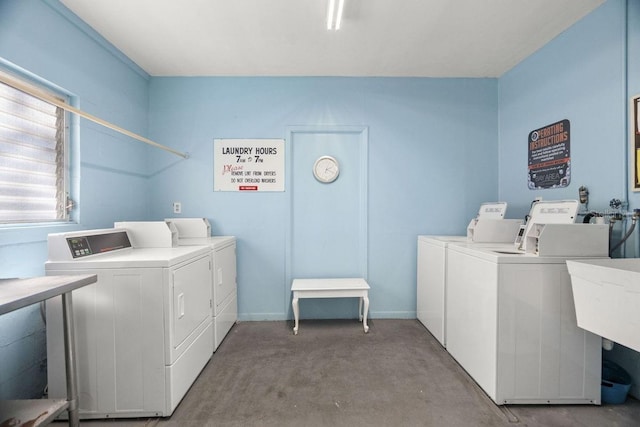 laundry area featuring washing machine and clothes dryer