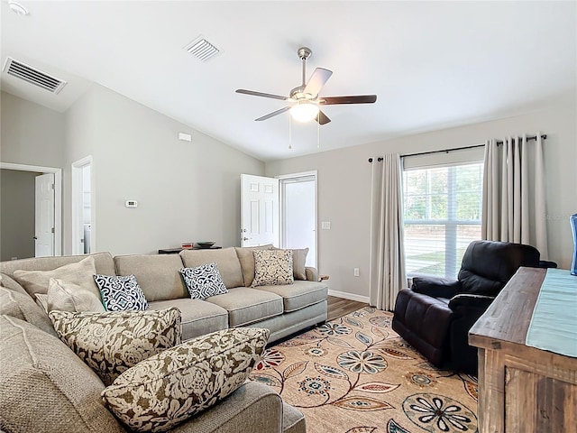 living room featuring light wood-type flooring, ceiling fan, and lofted ceiling