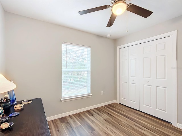 unfurnished office featuring hardwood / wood-style flooring and a wealth of natural light