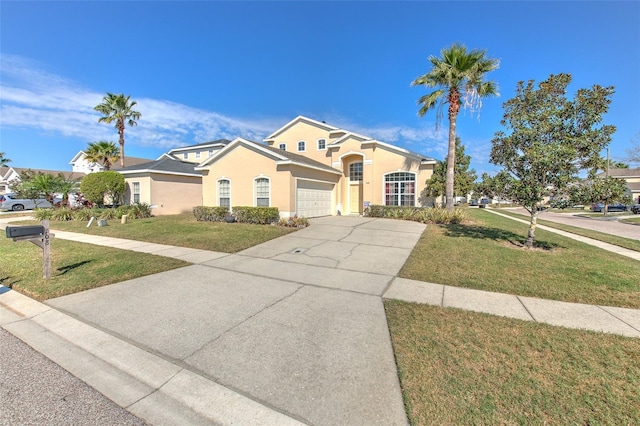 view of front of property with a garage and a front lawn