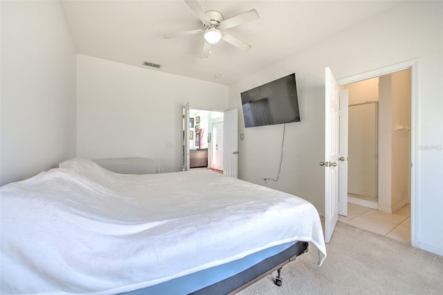 bedroom featuring light carpet and ceiling fan