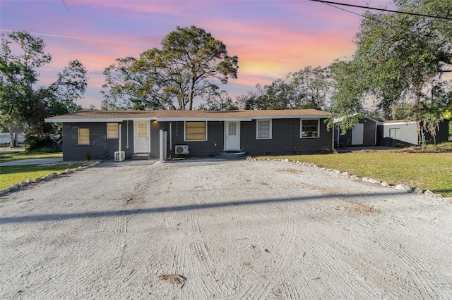 single story home featuring a yard