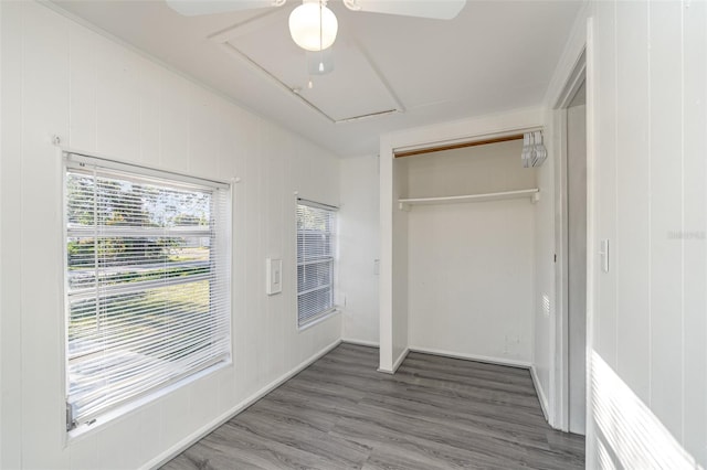 interior space featuring wood-type flooring, a closet, and ceiling fan