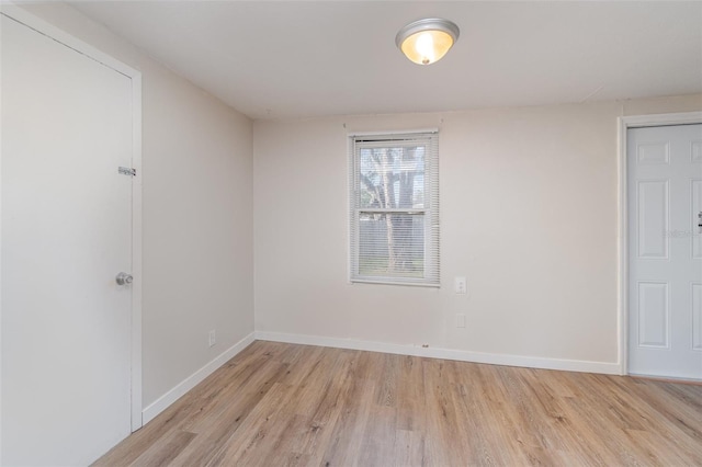 spare room with light hardwood / wood-style flooring