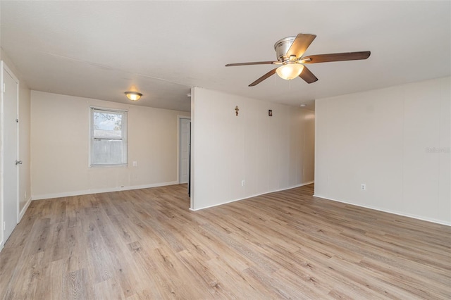 empty room featuring ceiling fan and light wood-type flooring