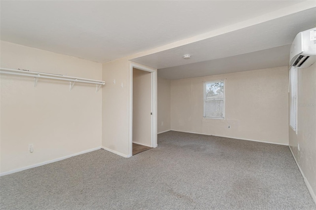 basement with an AC wall unit and carpet floors