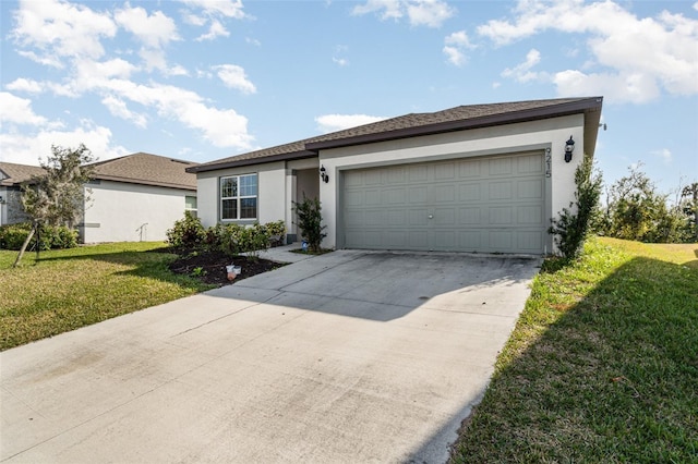 single story home with a garage and a front lawn