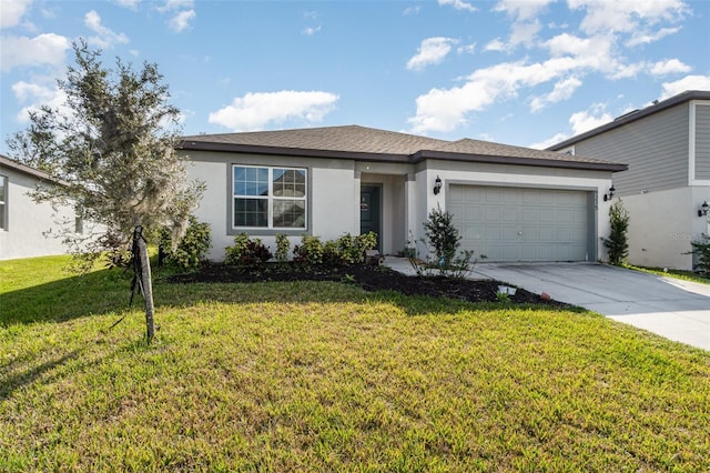 view of front of property featuring a front yard and a garage