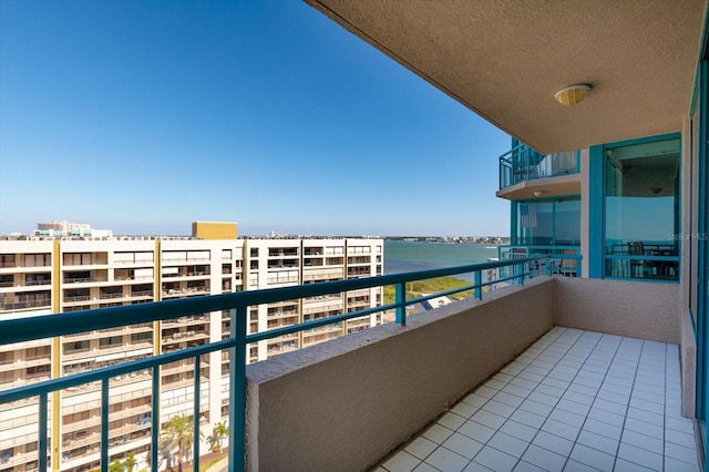 balcony featuring a water view