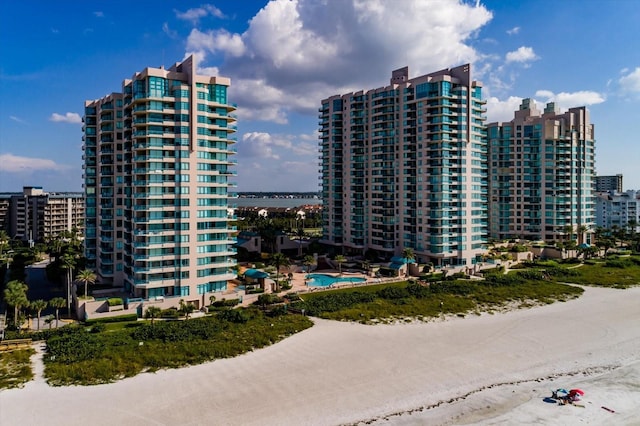 view of property with a view of the beach