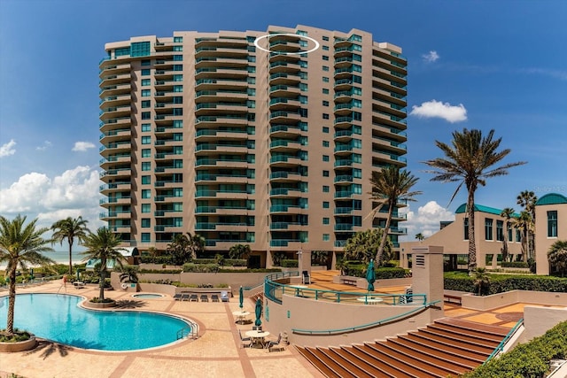 view of swimming pool with a patio area