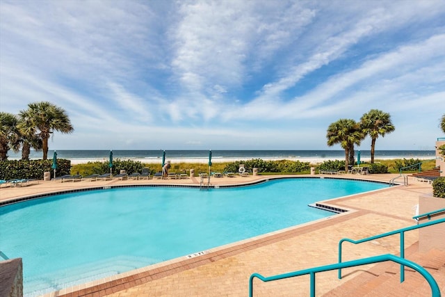 view of pool featuring a water view