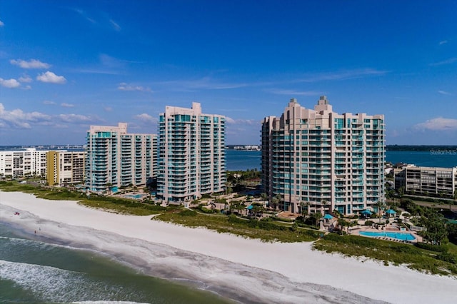 bird's eye view featuring a beach view and a water view