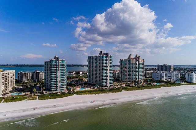 birds eye view of property featuring a view of the beach and a water view