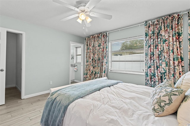 bedroom with ceiling fan and light wood-type flooring