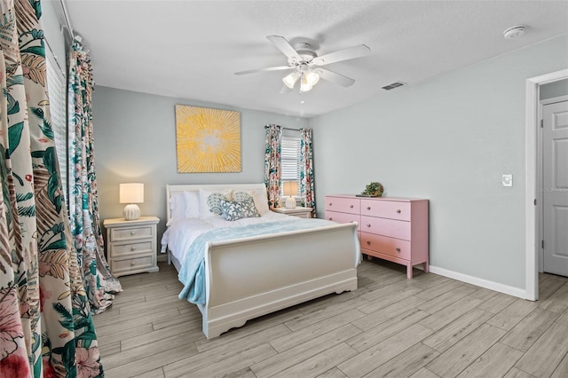 bedroom featuring light wood-type flooring and ceiling fan