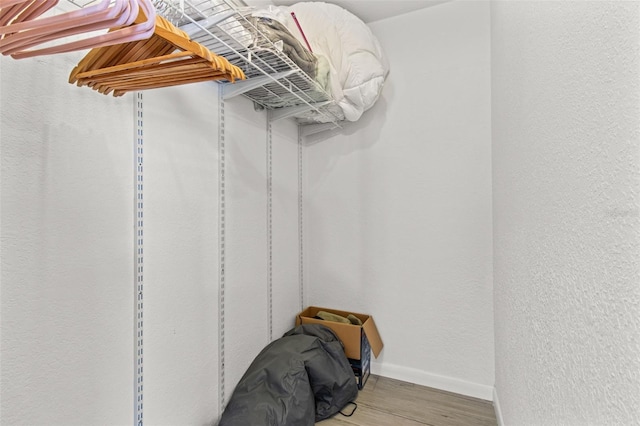 walk in closet featuring wood-type flooring