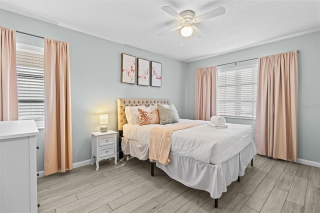 bedroom featuring ceiling fan and light hardwood / wood-style flooring