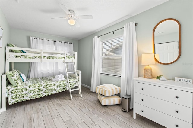 bedroom featuring ceiling fan and light hardwood / wood-style flooring