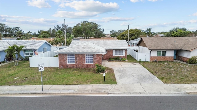 ranch-style house with a front lawn