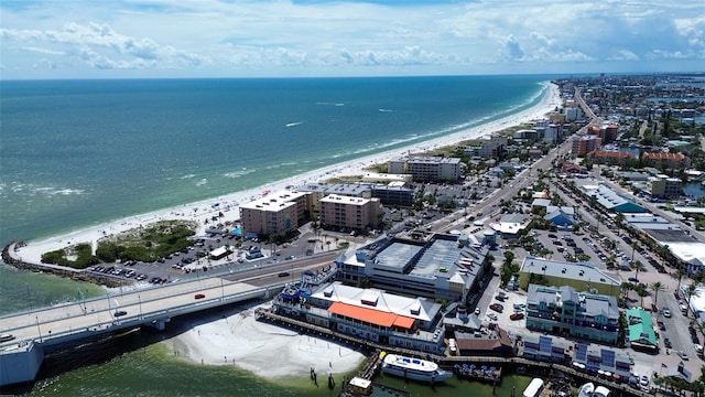 bird's eye view with a water view and a view of the beach