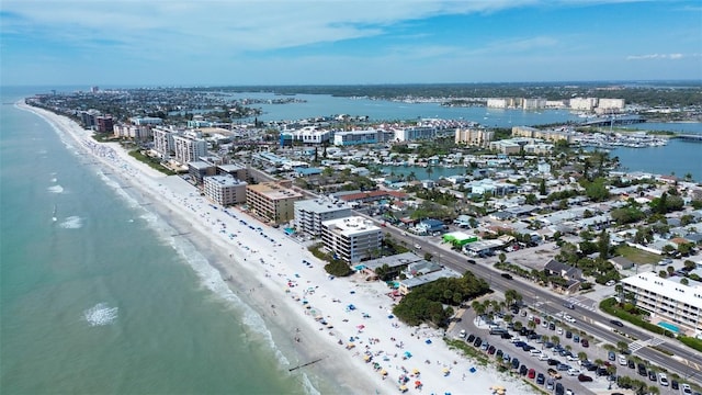 aerial view with a water view and a view of the beach