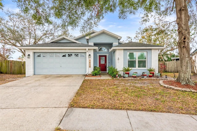 view of front of property with a garage