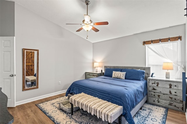 bedroom featuring vaulted ceiling, ceiling fan, and hardwood / wood-style floors