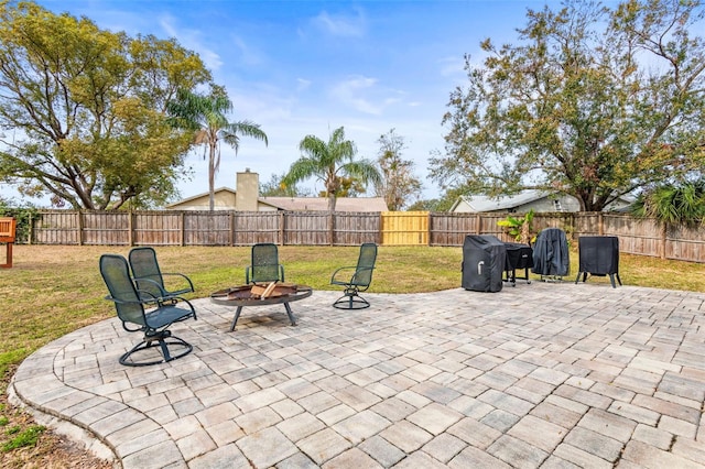 view of patio featuring an outdoor fire pit and area for grilling